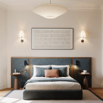 Modern bedroom with blue upholstered headboard, bedside tables, wall art, and cozy lighting. Cozy and elegant design.